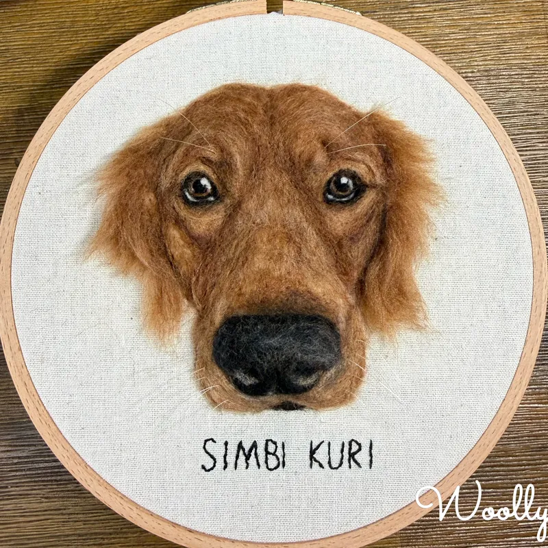 Needle felted golden retriever portrait named Simbi Kuri in a wooden embroidery hoop